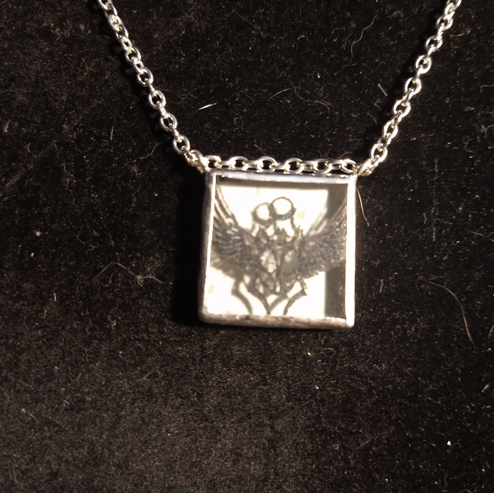 Engraved winged scarab glow necklace